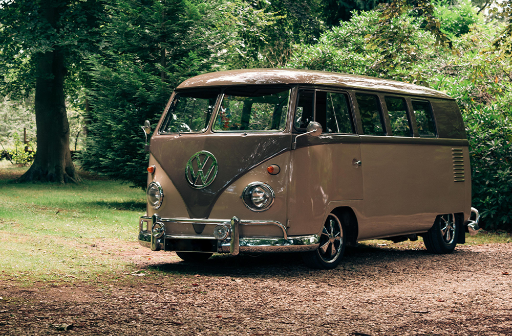 VW campervan parked in green area