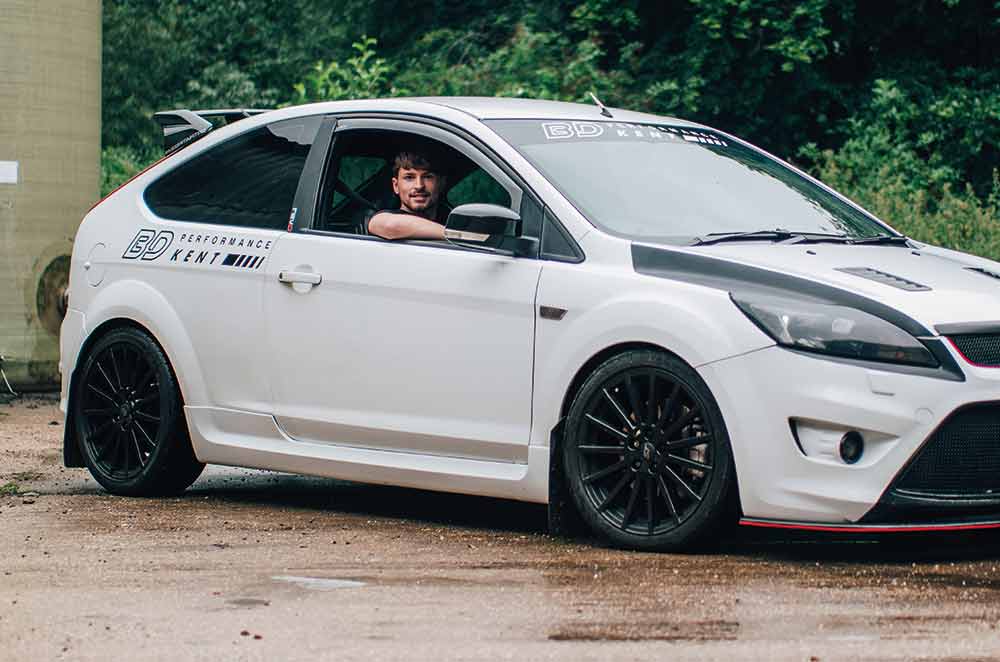 Man sitting in a modified car