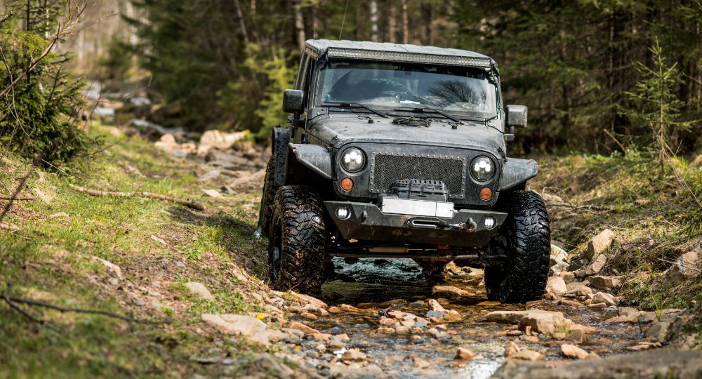 Jeep off-roading on rocky terrain