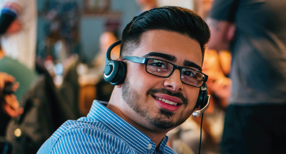 Person with headphones on working in call centre