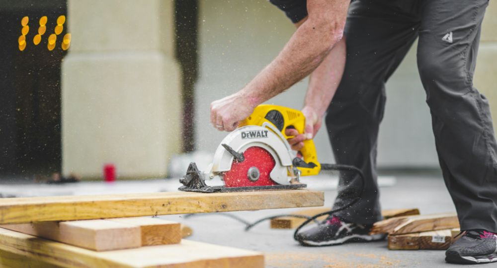Builder using circular saw to cut wood