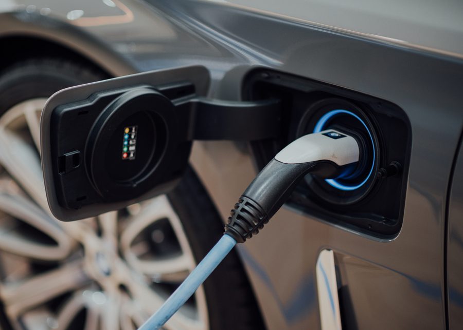 Electric car plugged into a charging point