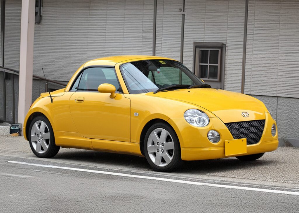 Yellow Daihatsu Copen parked on the street