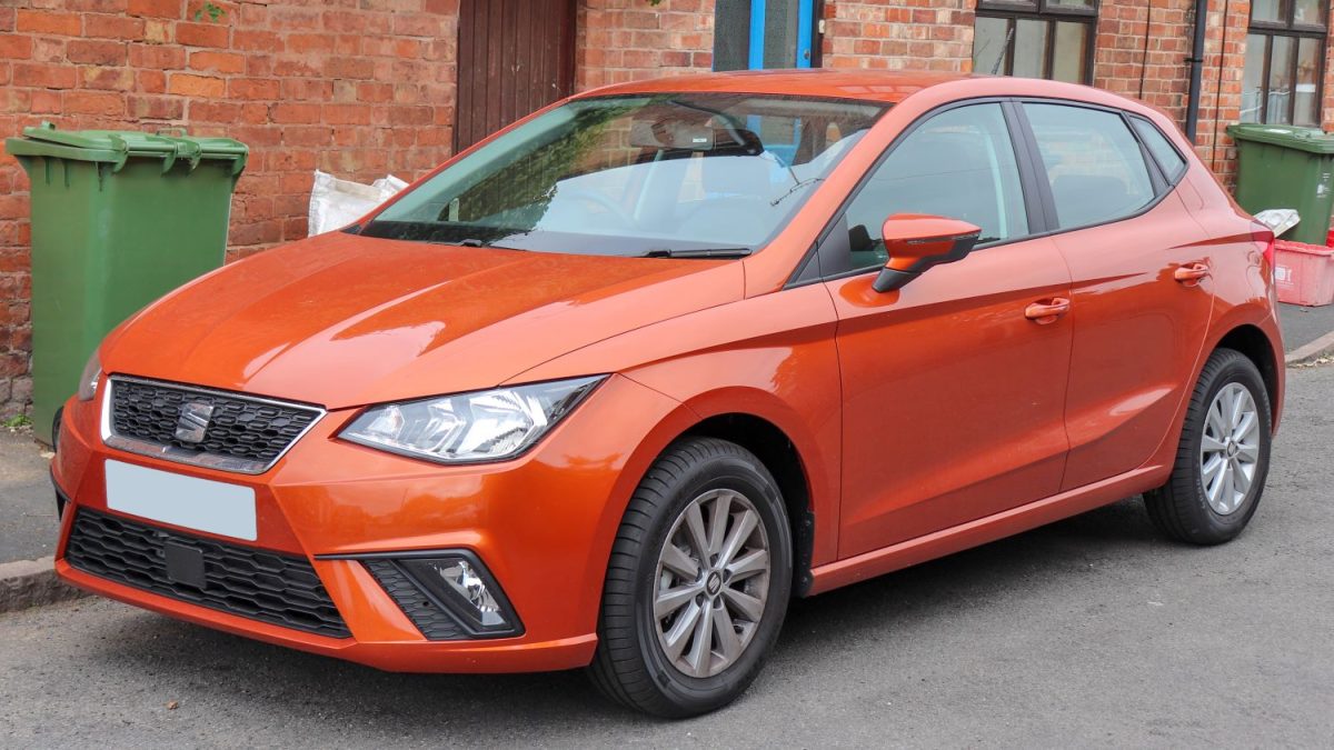 Orange Seat Ibiza car parked outside