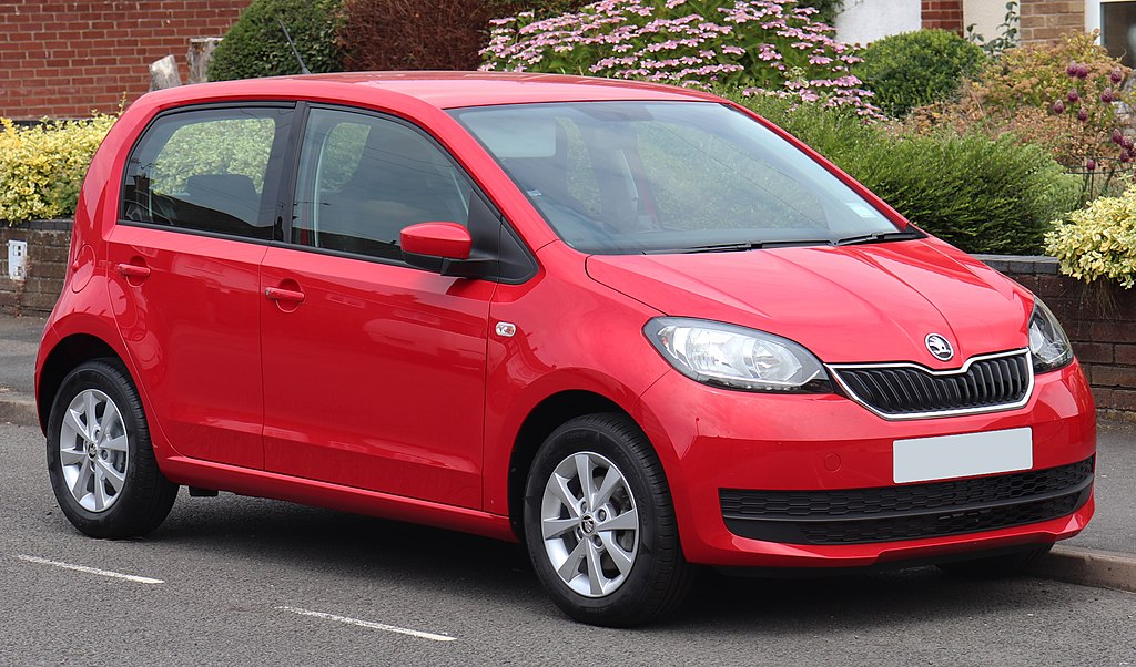 Red Skoda Citigo parked in residential area
